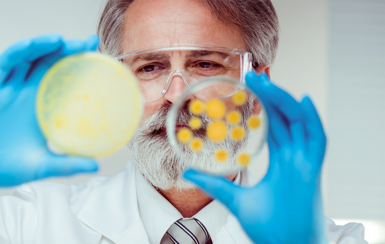 Scientist with petri dish
