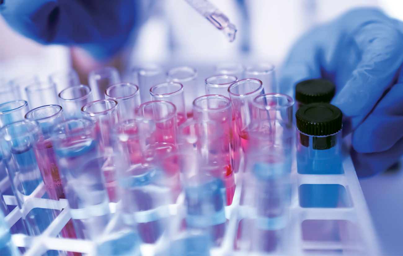 lab technician with test tubes