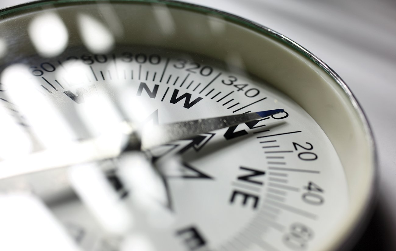 Charles-River-Associates-Compass-Pointing-North