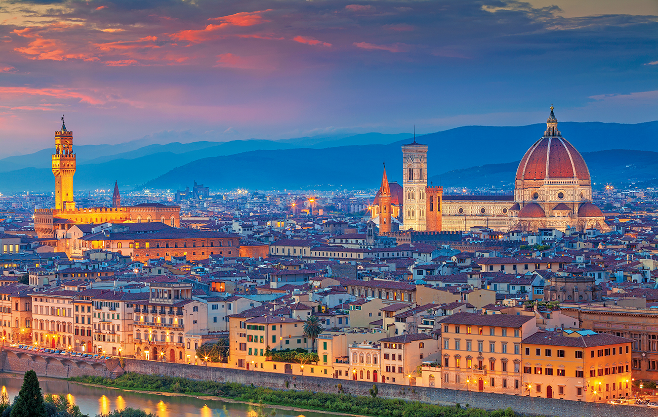 Cityscape image of Florence, Italy during dramatic sunset.