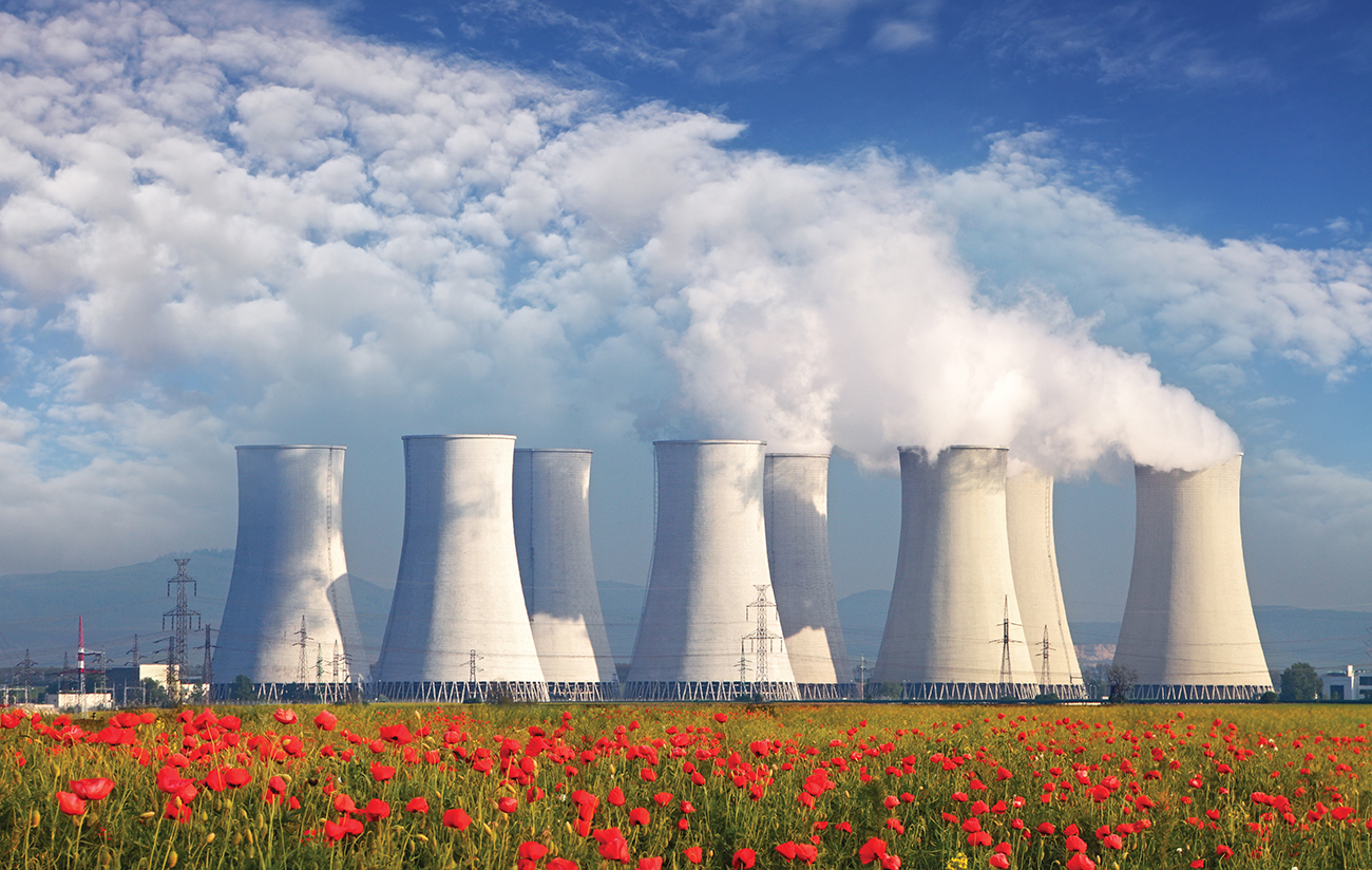 Nuclear Power plant with red field and blue sky