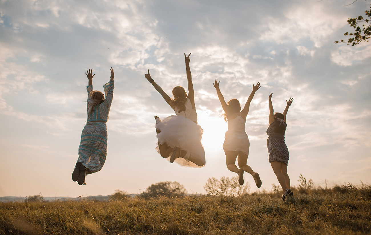 Young Women Jumping Girl Scouts
