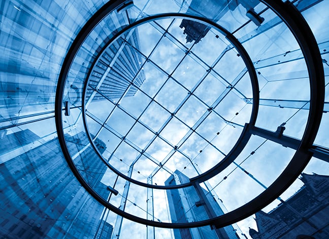 Glass atrium with view of skyscrapers