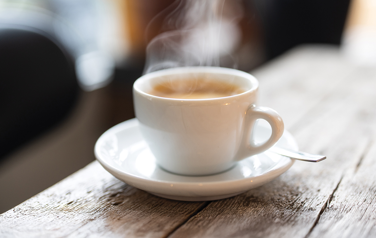 Refreshing hot cup of coffee at a cafe