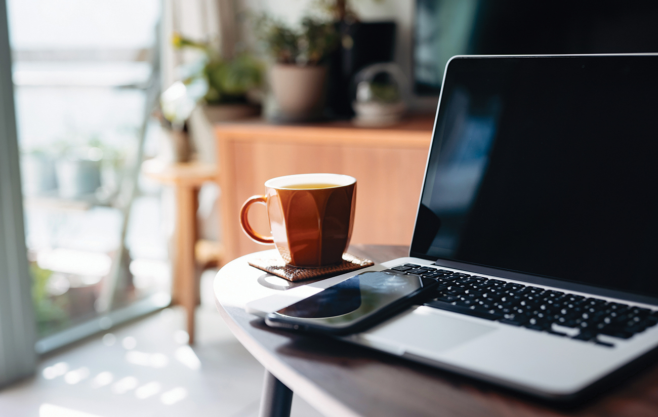 laptop, smartphone and a cup of tea