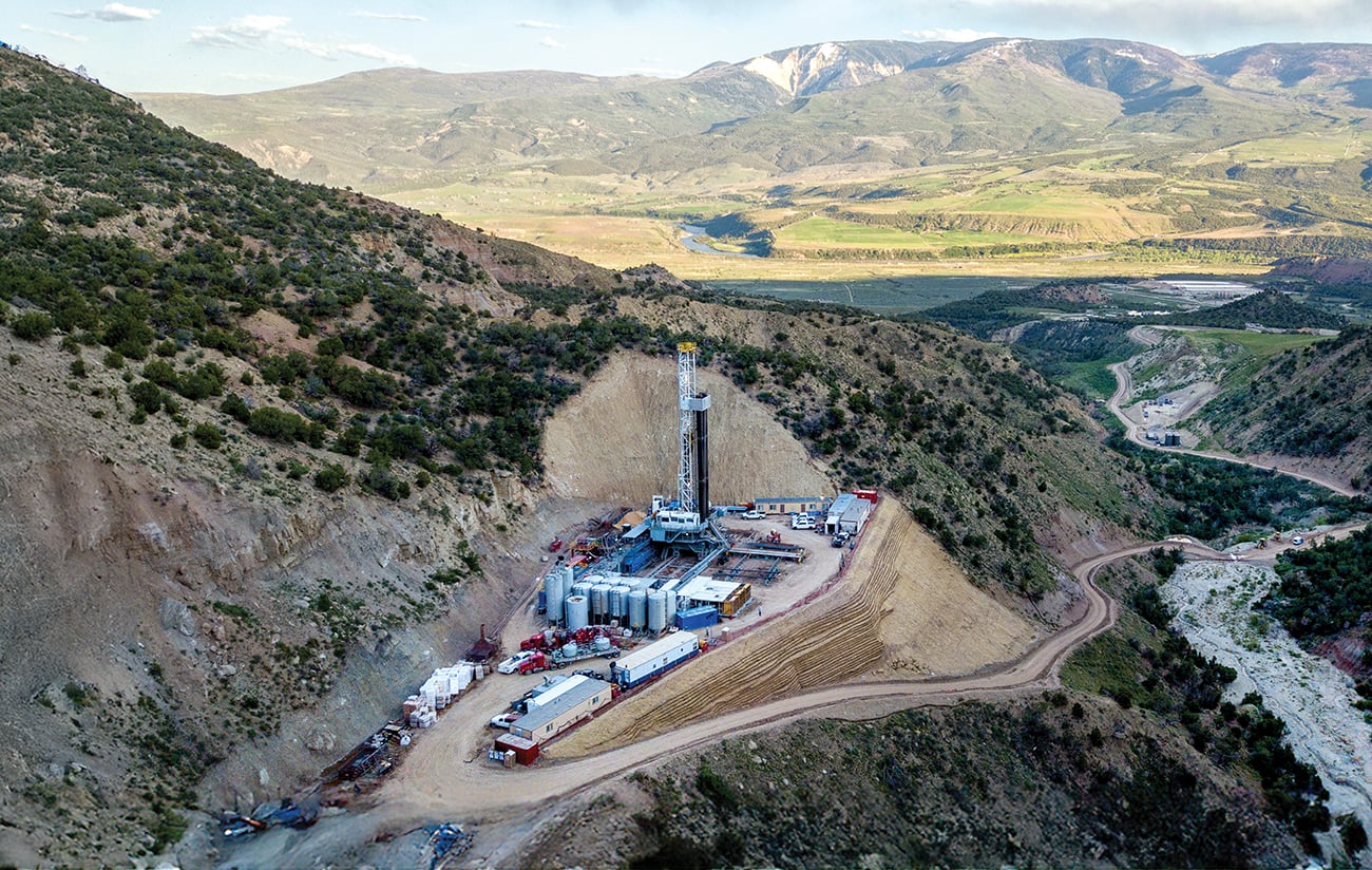 An Aerial View Of A Fracking Drill Rig On The Side Of A Mountain In Colorado In Late Spring